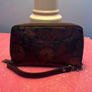 Patricia Nash wristlet with dark flower motif